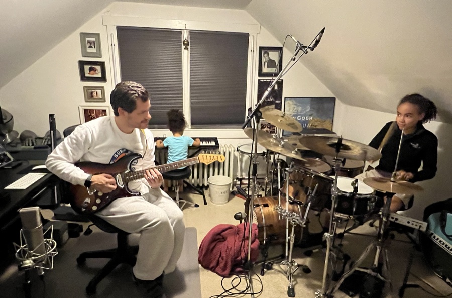 Jake Munch teaching guitar and drums in his studio