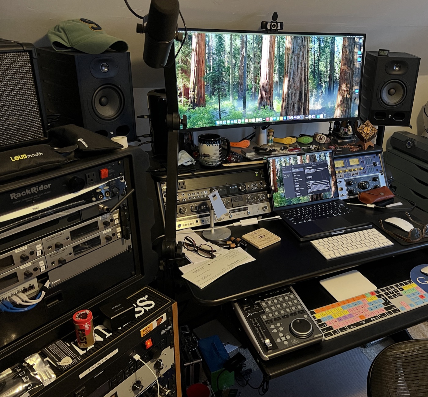 Studio desk with outboard rack gear, Focal monitors, and DAW on screen